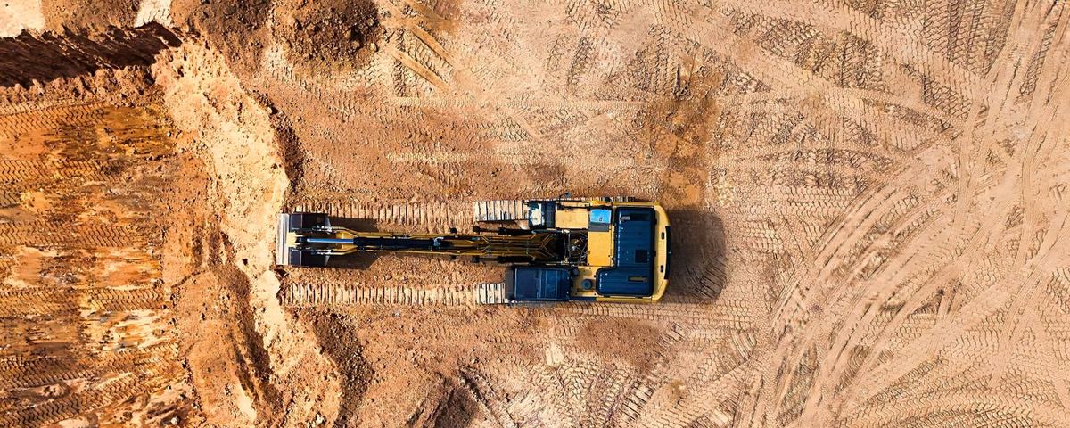 Aerial view of an excavator cutting a formation on an earthworks site