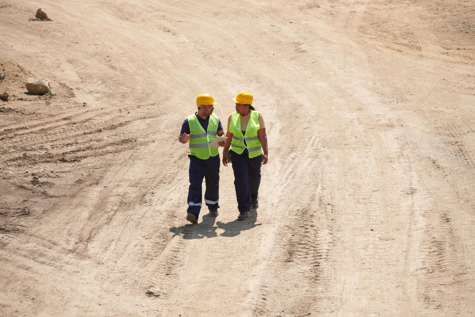 Site team in hard hats and hi-vis on a construction site